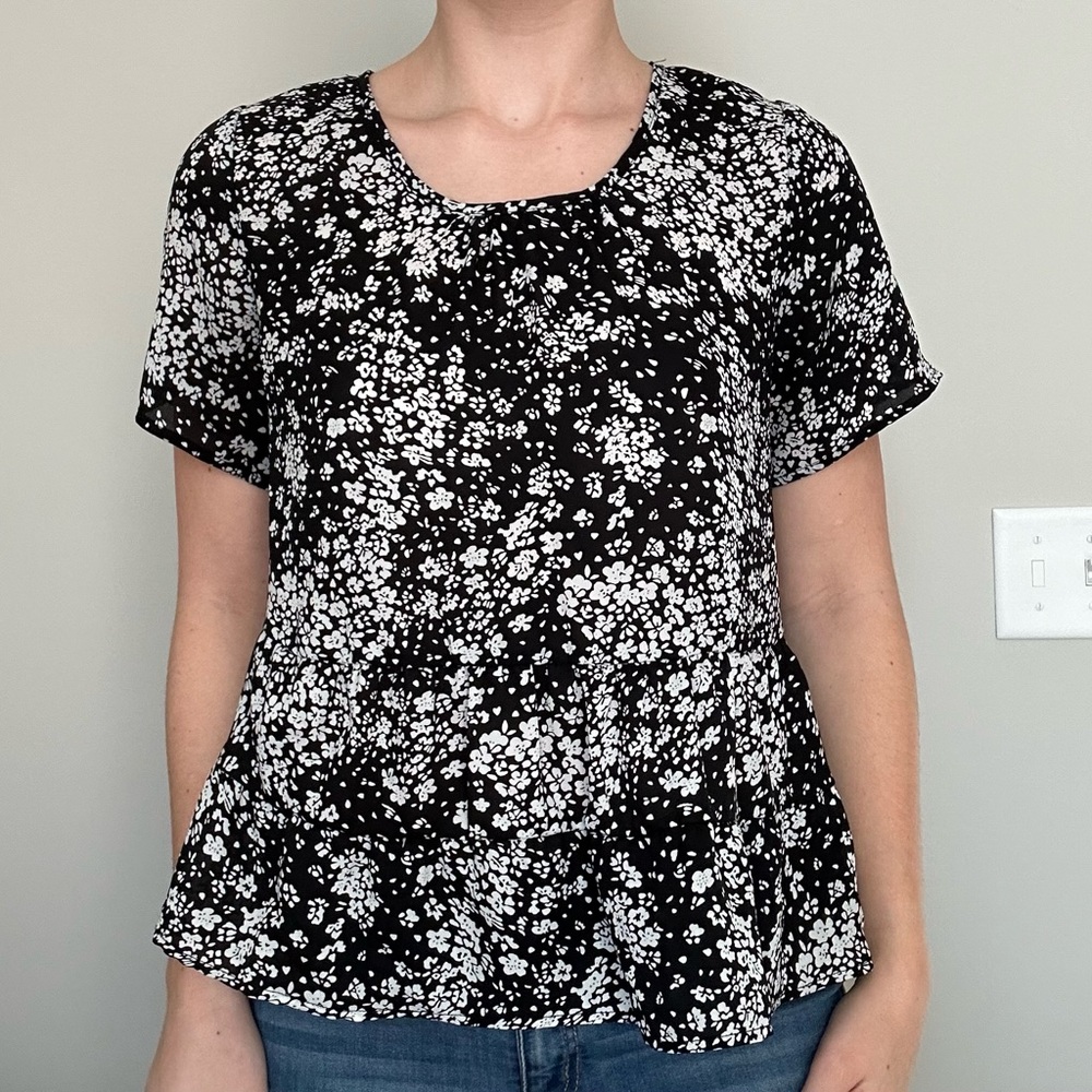 Black and white womens peplum blouse. Size medium.